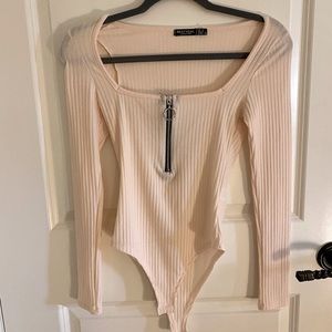 Nasty Gal women’s blush bodysuit. Never worn.
